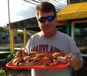 Andy Johnson holding a tray of crab