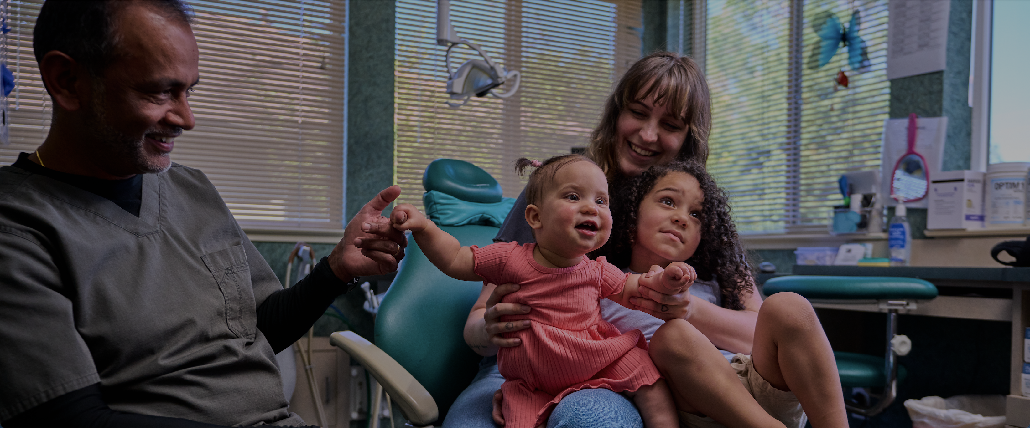 Photo of Wild About Smiles clients with Dr. Francis