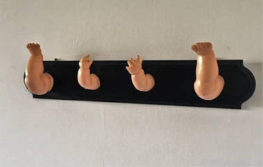 coat rack from dismembered baby dolls