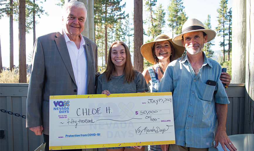 Vax Nevada Days week 2 winner with Governor Sisolak, mother and father