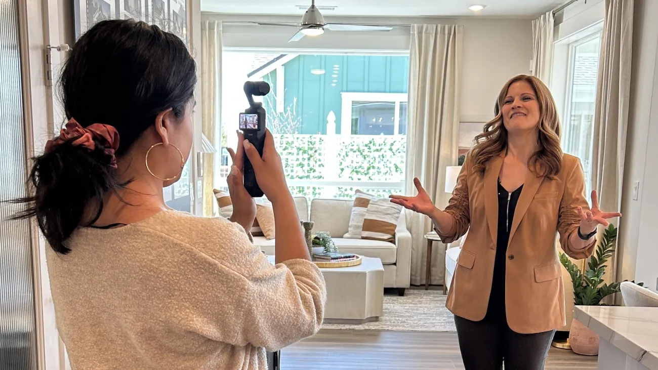 Alyssa Rodriguez filming social media content using a portable Osmo camera